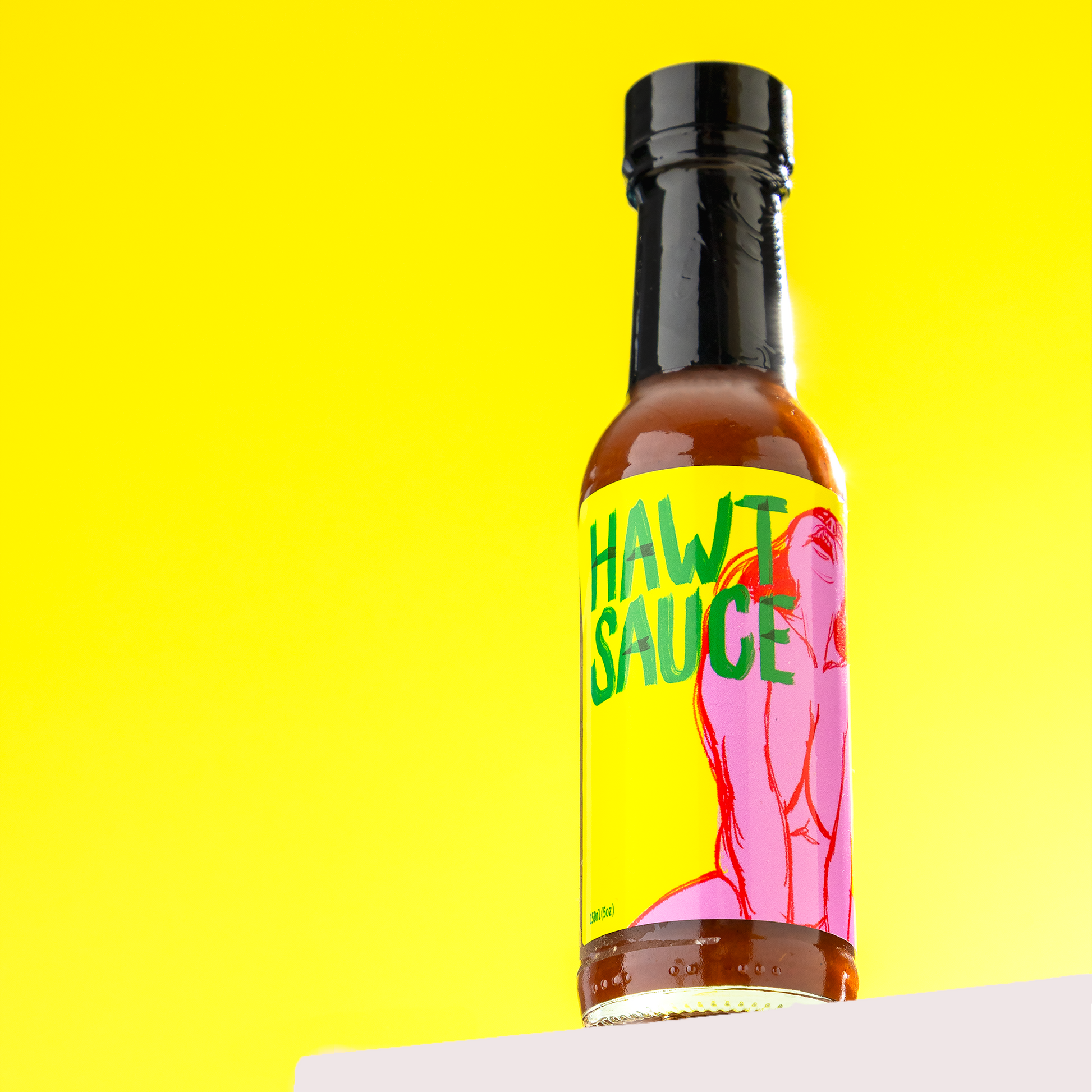Bottle of 'Hawt Sauce' with a colorful label on a yellow background